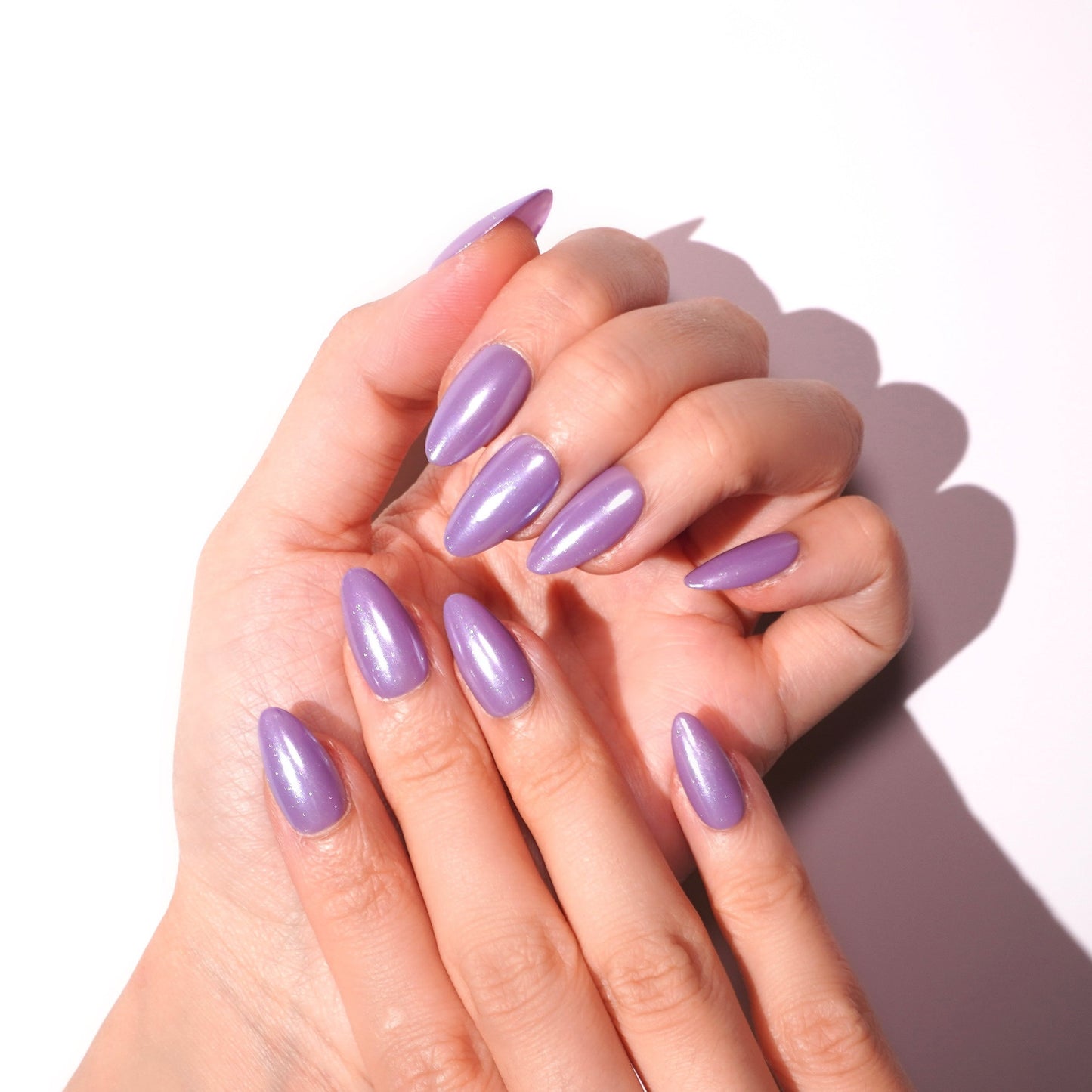 almond glossy purple shimmer fake nail-sheherauar